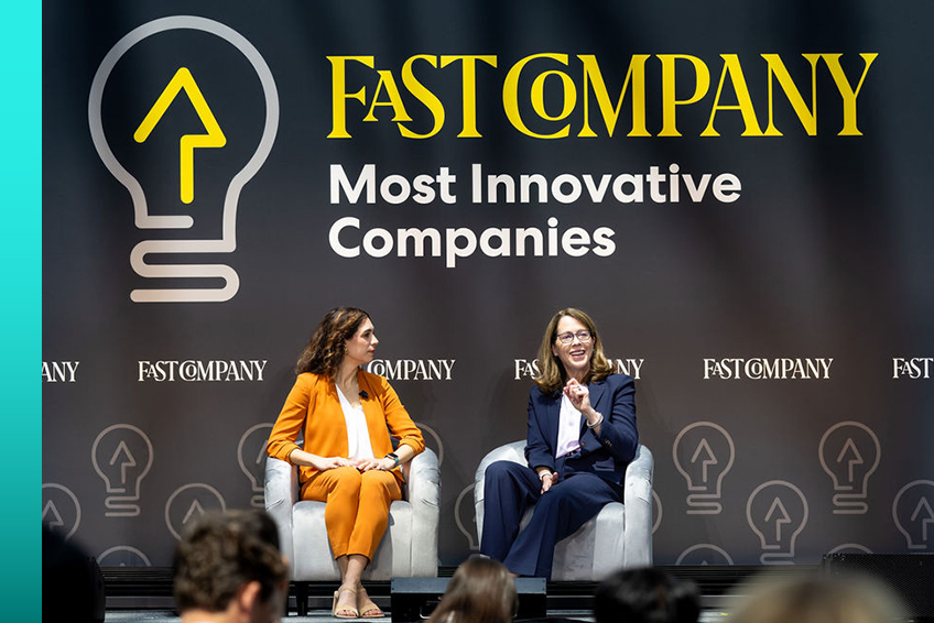 Fast Company Most Innovative Companies event with Lumen CEO Kate Johnson on stage speaking in front of an audience.