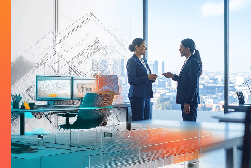 Two suited individuals talk to each other in a modern, energizing office space.